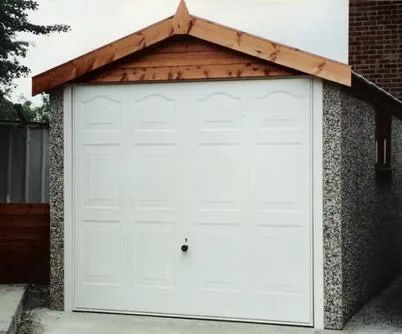 Single concrete garage with an apex roof.