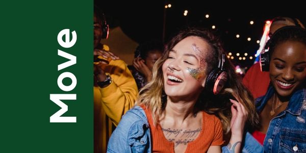 People enjoying a night party with headphones and glitter face paint.