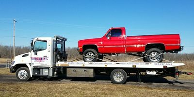Flatbed tow of square body truck
