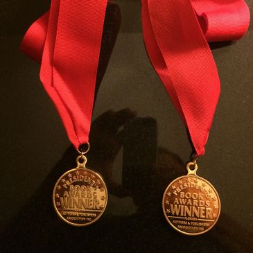 Gold medals and first place awards in historical fiction and young adult/new adult categories.