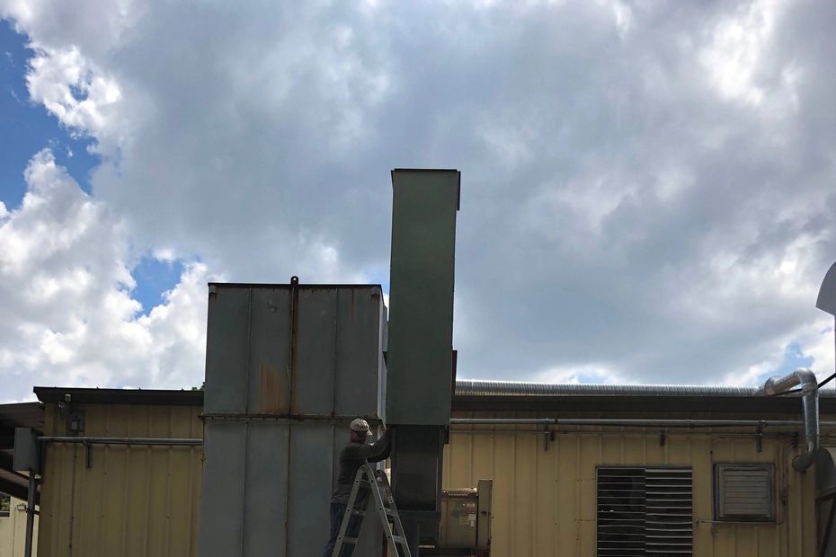 Air Stack added to existing baghouse and blower to enhance air flow and reduce sound level.