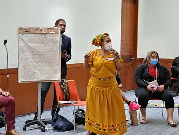 woman facilitator at in-person forum