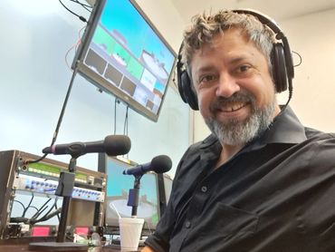 male audio engineer in television studio