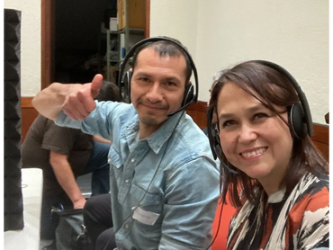 male interpreter and female interpreter at booth
