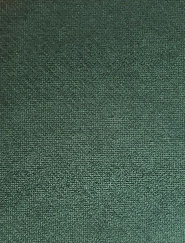 Close-up of green textured fabric with a woven pattern.