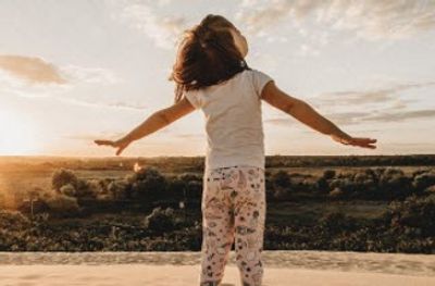 child gazing up into the sky