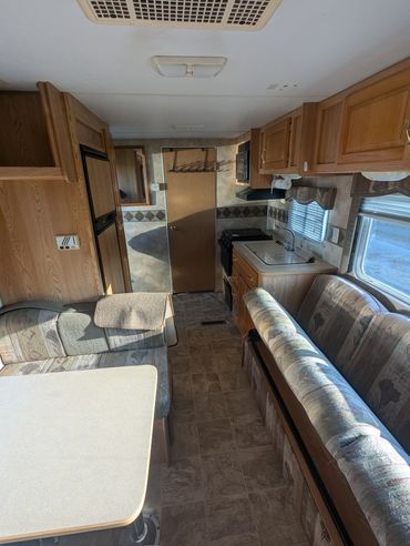 A look down the middle of The Hornet. Fridge, check. Stove, check. Space to eat, check.