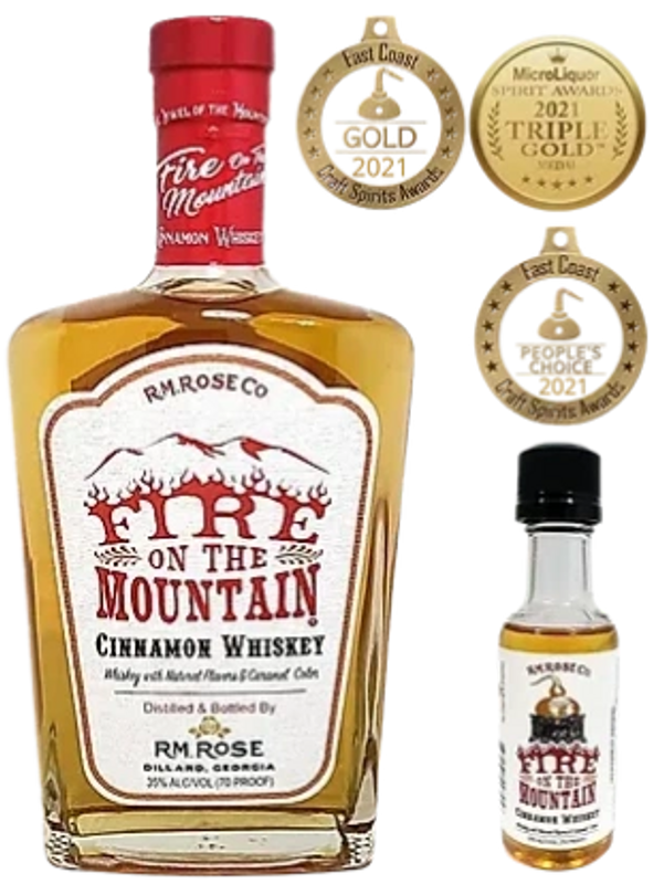 A bottle of Fire on the Mountain Cinnamon Whiskey with awards surrounding it.