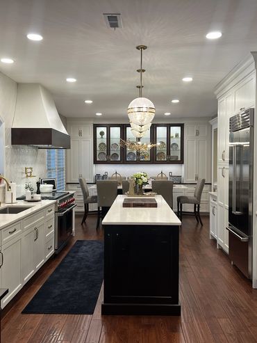 The wall separating the Kitchen/Dining areas was removed allowing this beautiful custom design. This