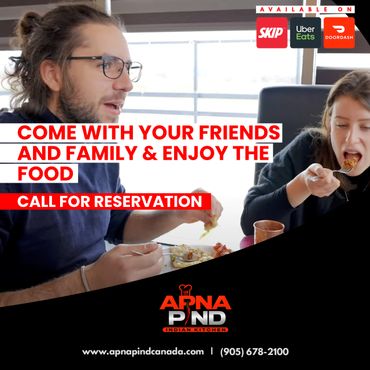 Friends enjoying a meal together at Apna Pind Indian Kitchen, available on delivery apps.