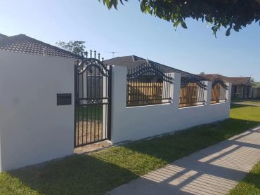 Curved top rail ornamental aluminium 1.8m pedestrian gate and block wall infill panels