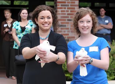 girls releasing doves