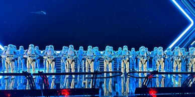 Line of stormtrooper figures with blue lighting.