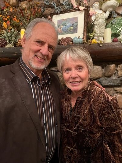 Two people standing close to each other