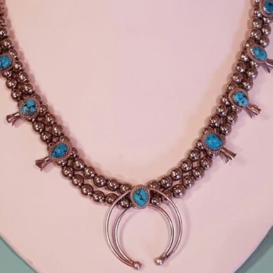 beaded necklace on a holder