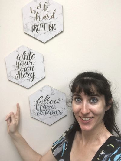 Treatment room signs: "Work hard dream big," "Write your own story," "follow your dreams"