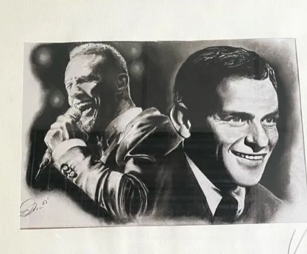 Black and white portrait of two men, one singing and one smiling.