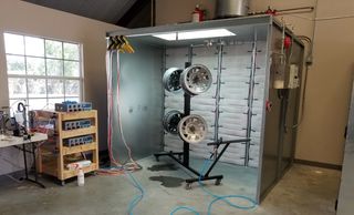 Powder coat booth with wheels ready for refinishing
