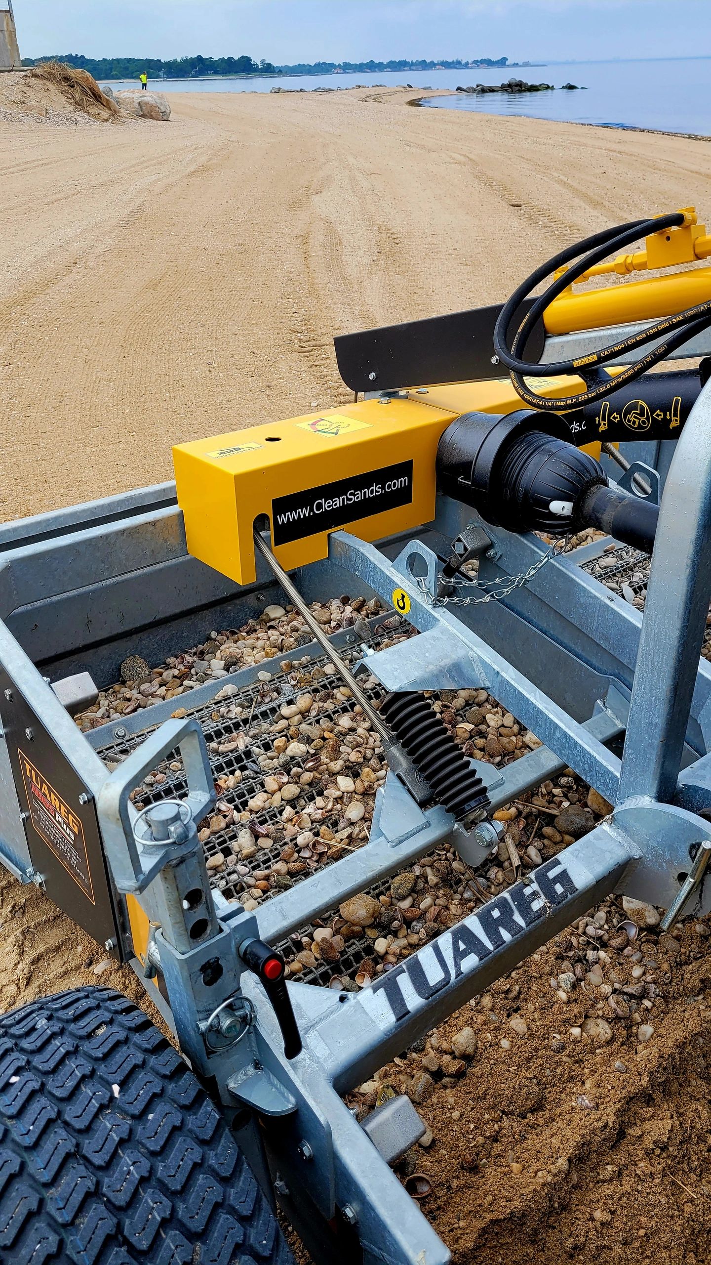 HD65 sifting debris. A heavy-duty beach cleaner that is tractor attached
