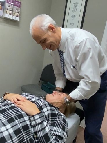 Dr. Reizer adjusting a patient.