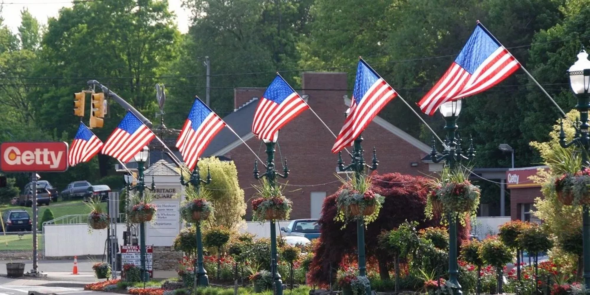 American flags proudly displayed from lamp posts on Main Street.