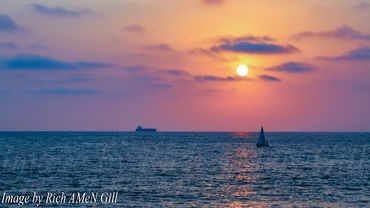 Images Taken By Rich AMeN Gill of Colorful Beach Sunsets against Various California Piers....