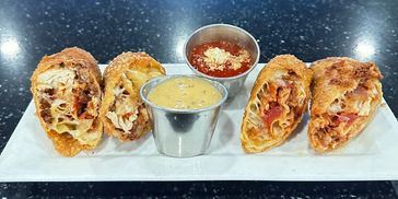 Chicken Parmigiana Eggrolls
Crispy eggrolls packed with tender chicken fried steak, melted mozzarell
