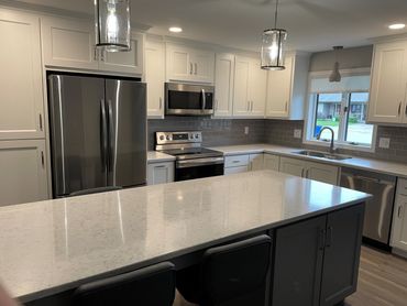 Painted gray and white kitchen in duplex remodel