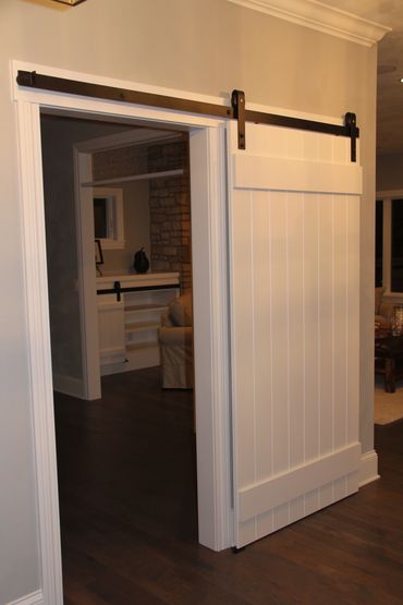 Grooved painted barn door with matte black track