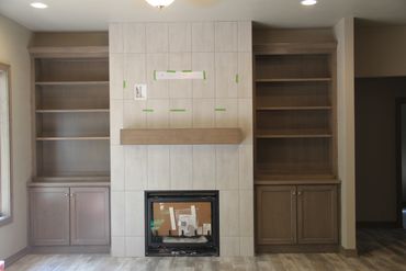 Stained maple built-ins with wood top and crown molding