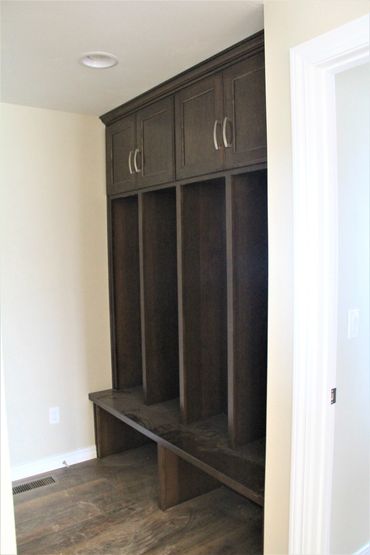 Locker cabinetry with centered middle dividers for separated storage for each family member