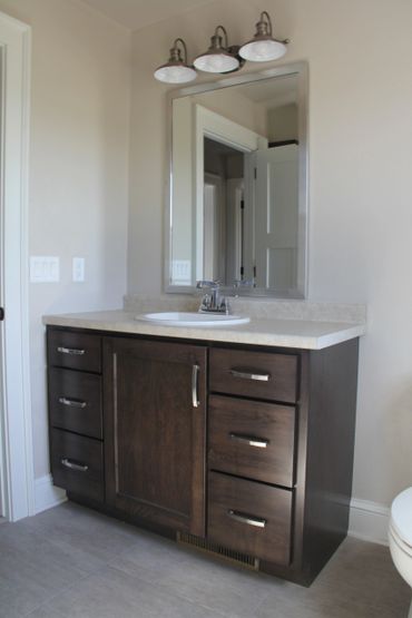 Stained maple vanity installed by Fox Valley Technical College's residential construction students