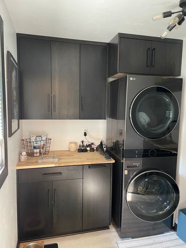 Stacked washer/dryer with dog food base cabinet pull-out