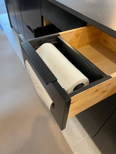 Paper towel storage from the front of frameless cabinet drawer