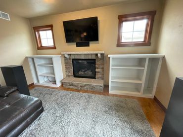 Custom entertainment cabinetry housing speakers and game consoles