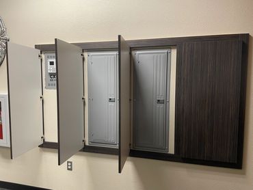Commercial doors that hide electrical panels