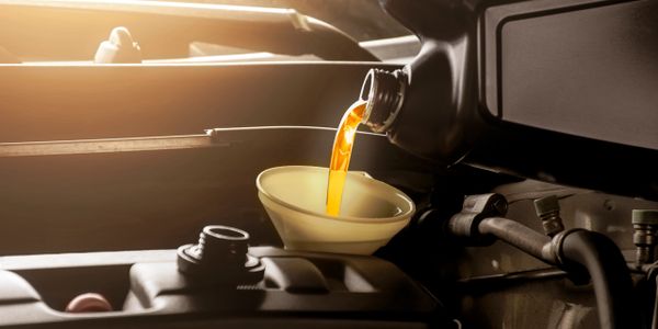 Filling up oil on a vehicle