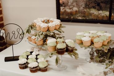 Green and White cupcakes with greenery and MRS sign