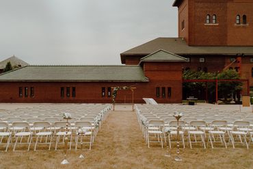 aisle outdoors with arch at center