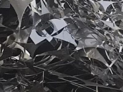 Close-up of crumpled reflective metallic material.