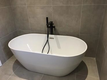 bath with black tap