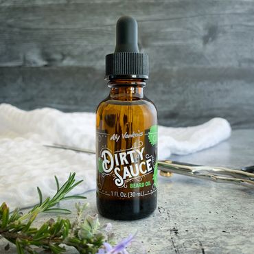 Rosemary Dirty Sauce with barber scissors, waffle-weave towel, and cedar tips on wood and concrete.