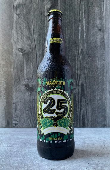 25th Anniversary Bluesapalooza bottle with hops, seal, pines, and small bear head.