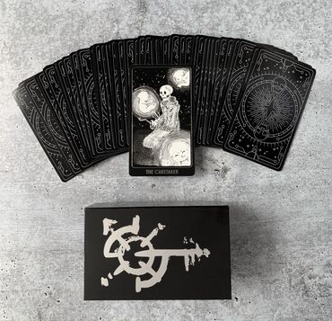 Card backs and The Caretaker (a skeleton wearing a hoodie robe, with glowing baby stars).