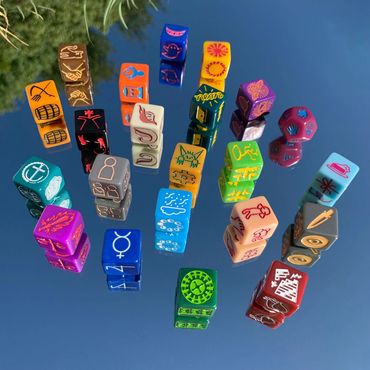 Dice placed on a mirror, showing an array of different symbols.