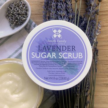 Lavender sugar scrub styled with dried lavender and a tea towel.