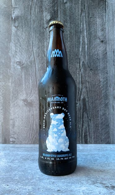 Belgian-Style Quadrupel Ale bottle depicting a bear made of blue sky and fluffy white clouds.