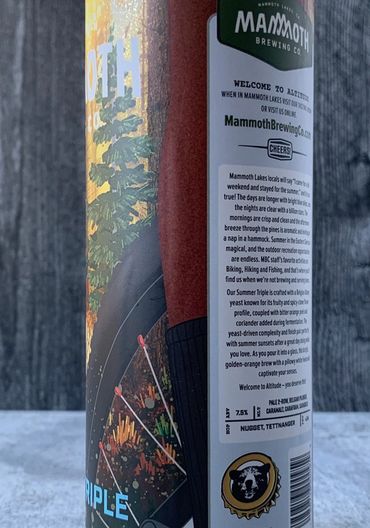 Closeup of Summer Triple showing mountain bike tire and cyclist's leg.