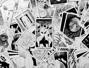 The Burning Garden with many other cards from the deck in the background.