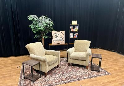 Cozy interview setup with two armchairs and side tables.